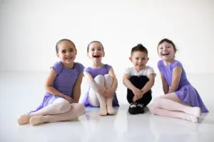 Primary 1 students smiling for a picture at Cavod Performing Arts.