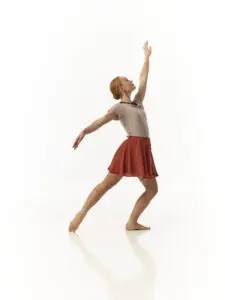 A dancer from Cavod's adult modern dance class posing