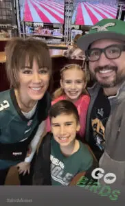 A family smiling for the camera while at Cavod Performing Arts' Manheim, PA location.