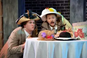 The cast of the show "Hello, Dolly" playing out a scene at Cavod Performing Arts Theatre 