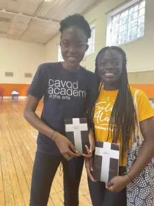 Two locals of Capetown, South Africa, posing with bibles they received from Cavod Academy.