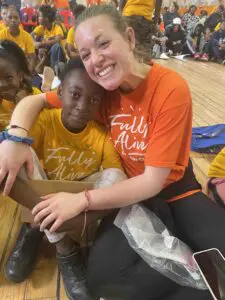 A Cavod Academy staff member taking a picture with a boy from Capetown, South Africa while on a missions trip. 