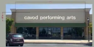 An far view of the sign for Cavod Performing Arts' Manheim location.