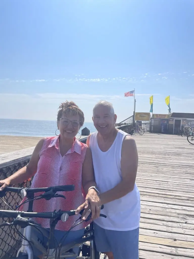 Cavod Performing Arts' founder posing for a picture with her husband in Ocean City, MD.