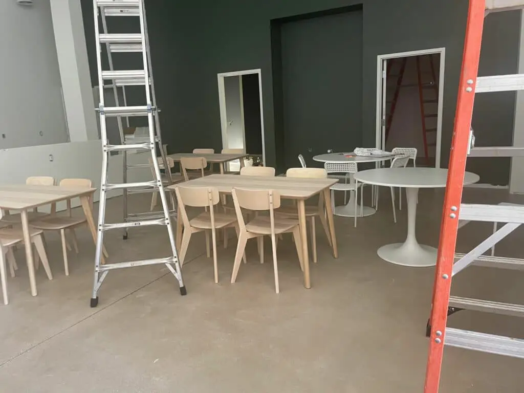 Chairs and tables being set up inside Cavod Performing Arts' new Manheim, PA location