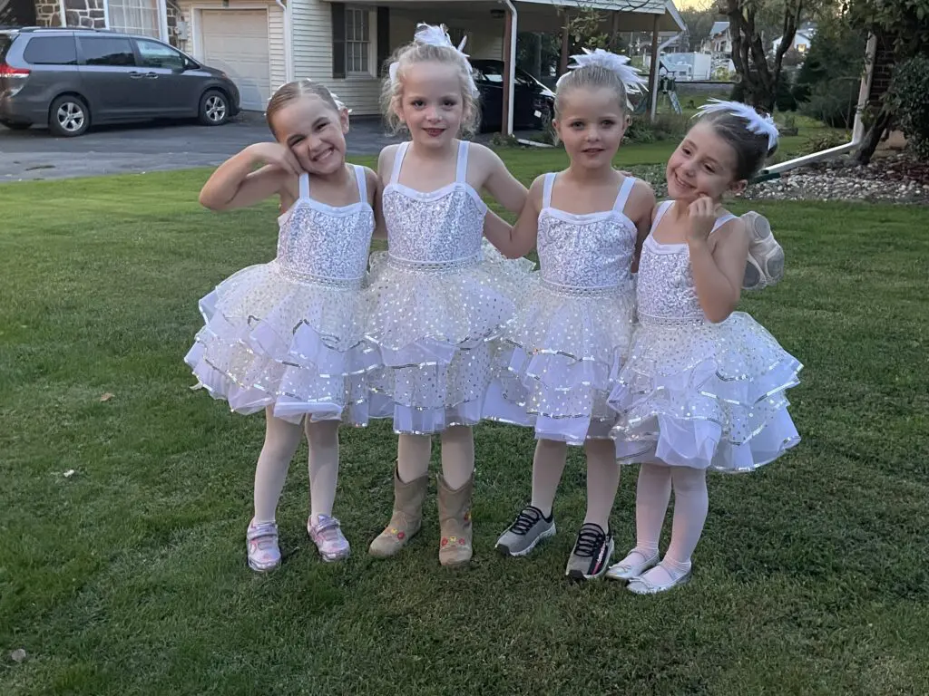 Children dancers from Cavod Performing Arts smiling for a picture post-parade performance.