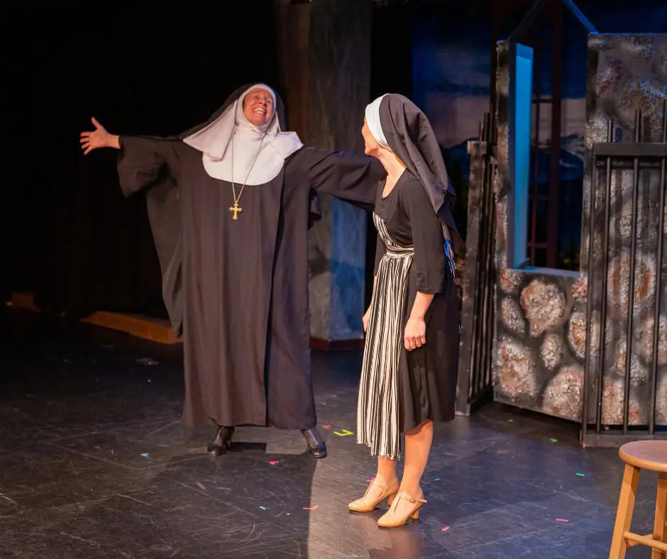 Two actors from Cavod Performing Arts dressed as nuns during the 2023 production of The Sound Of Music.