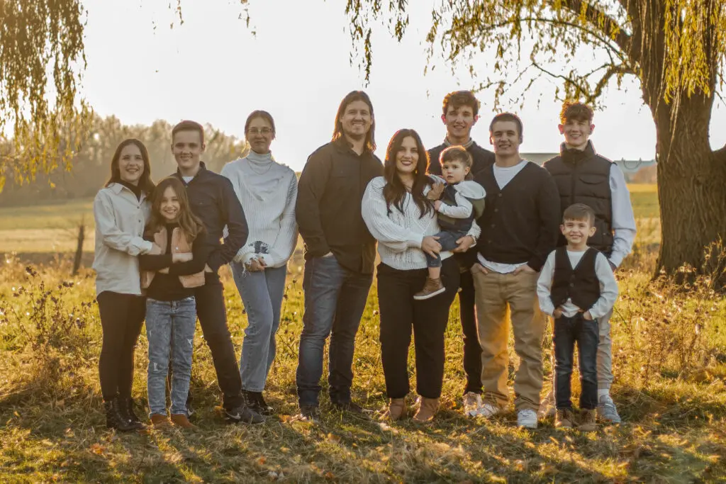 Connie Dienner's children and their family posing for a photo