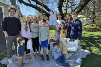 Dienner family taking a group photo while celebrating Easter
