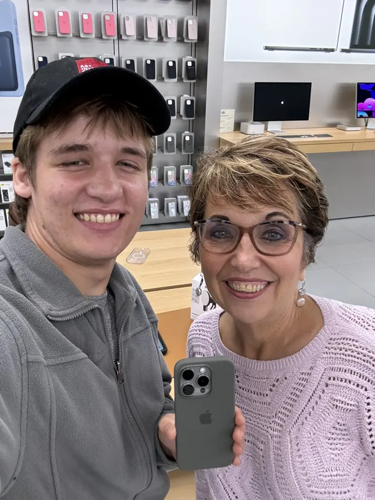 Connie Dienner and one of her grandsons at a phone store