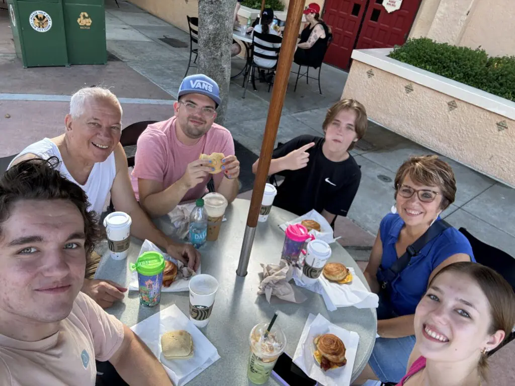 Cavod's Connie Dienner and family eating at a circular table outdoors