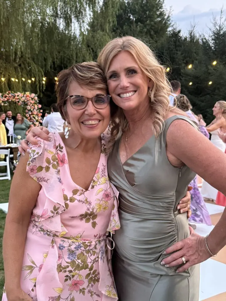 Cavod's executive director Connie Dienner taking a picture with Sierra's mom at Josiah and Sierra's wedding