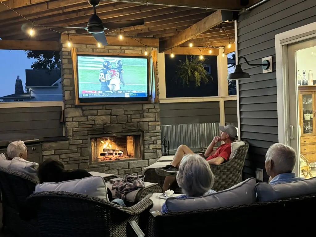 Connie from Cavod and family members gathered outside, watching an Alabama game.
