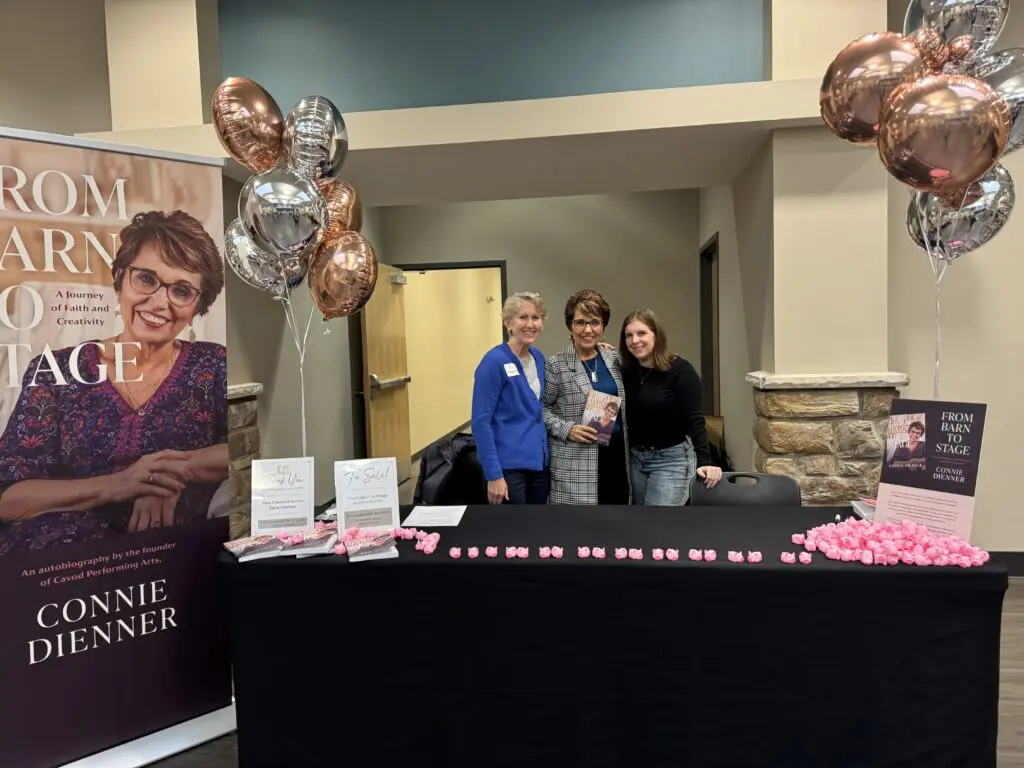 "Connie Dienner showcasing her book 'From Barn to Stage' at the anniversary event