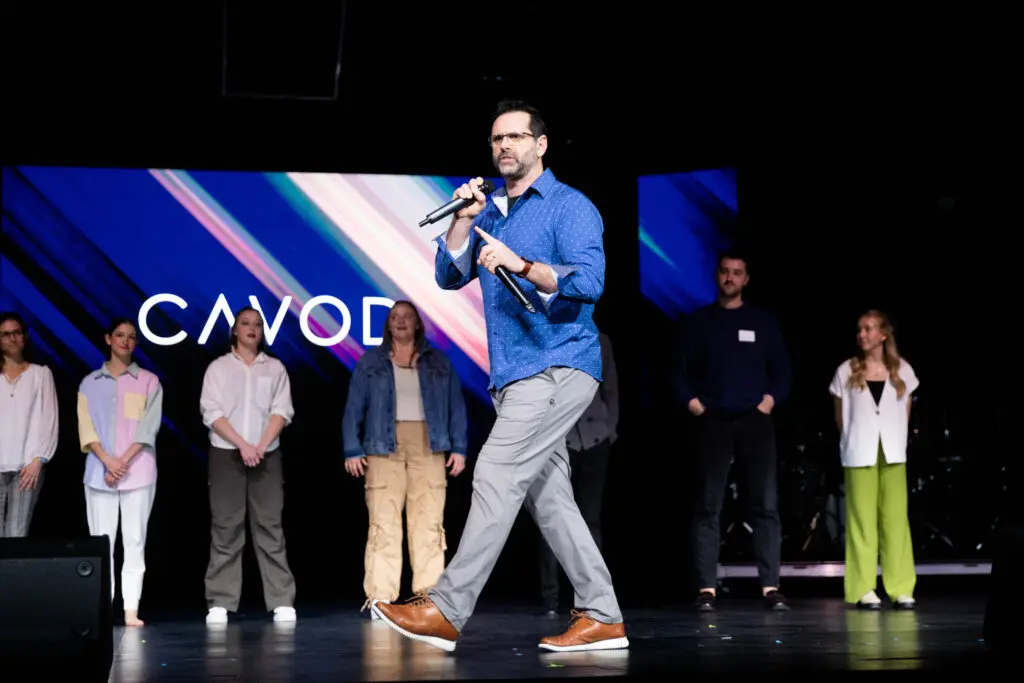 A guest speaker passionately speaking at Cavod’s 20-year celebration