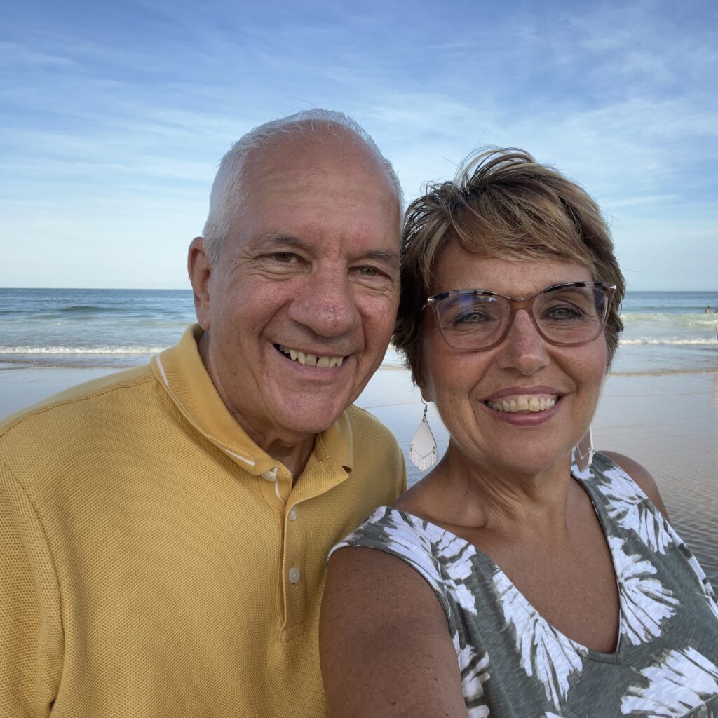 Connie on on the beach with her husband