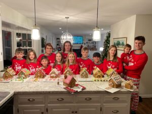 Cavod Executive Director Connie Dienner taking a picture with family members all wearing matching Christmas pajamas. 