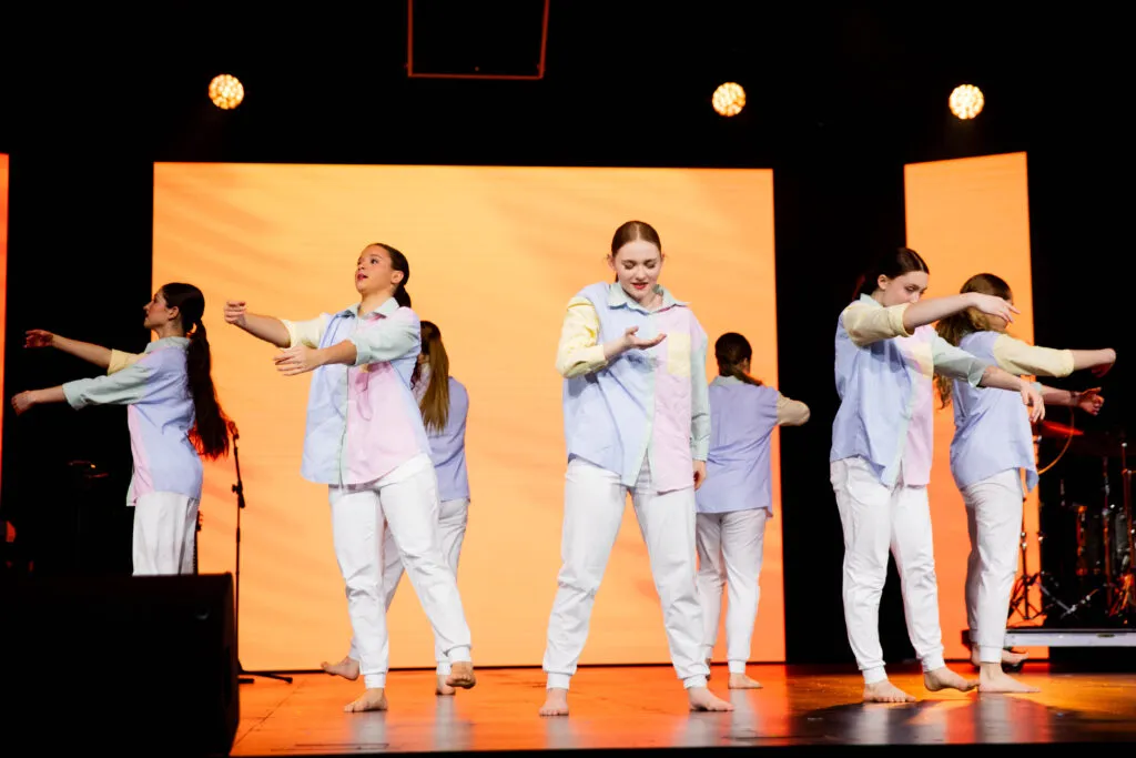 Elegant dancers performing a special routine during Cavod's 20-year celebration event.