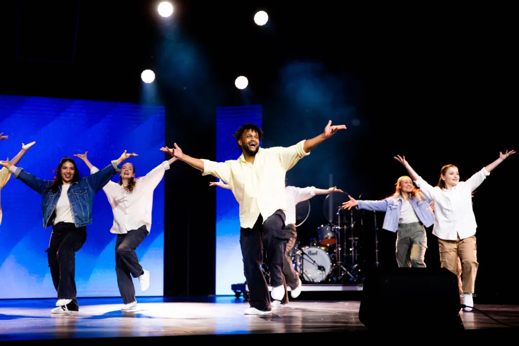 Actors on stage delivering a powerful theatrical performance at Cavod's anniversary celebration.